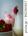 Strawberry ice cream with blurried strawberry and Milk on a foreground. High quality photo 90290907