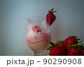 Strawberry ice cream with blurried strawberry and Milk on a foreground. High quality photo 90290908