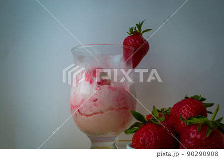 Strawberry ice cream with blurried strawberry and Milk on a foreground. High quality photo Strawberry ice cream with blurried strawberry and Milk on a foreground. High quality photo 90290908