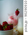 Strawberry ice cream with blurried strawberry and Milk on a foreground. High quality photo 90290910