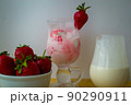 Strawberry ice cream with blurried strawberry and Milk on a foreground. High quality photo 90290911