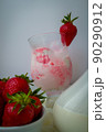 Strawberry ice cream with blurried strawberry and Milk on a foreground. High quality photo 90290912