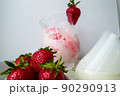 Strawberry ice cream with blurried strawberry and Milk on a foreground. High quality photo 90290913