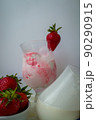 Strawberry ice cream with blurried strawberry and Milk on a foreground. High quality photo 90290915