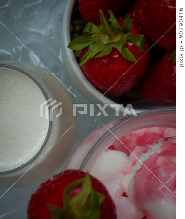 Strawberries ingridient with blurried strawberry ice cream on background. High quality photo Strawberries ingridient with blurried strawberry ice cream on background. High quality photo 90290916
