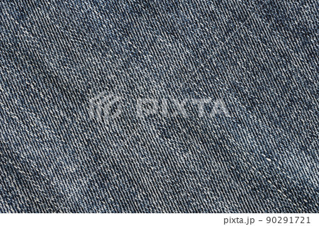 Detailed abstract texture of dark blue denim cloth. Background image of old used denim trousers fabric 90291721