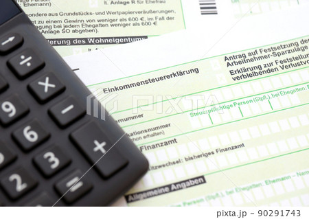 German annual income tax return declaration and calculator lies on accountant table close up. The concept of taxpaying period in Germany 90291743