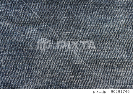 Detailed abstract texture of dark blue denim cloth. Background image of old used denim trousers fabric 90291746