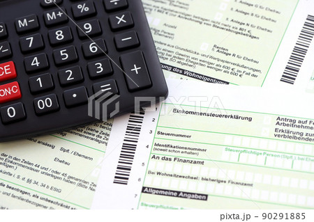 German annual income tax return declaration and calculator lies on accountant table close up. The concept of taxpaying period in Germany 90291885