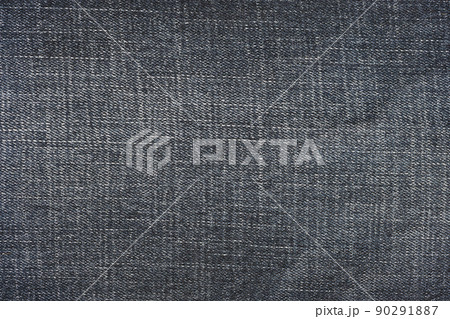 Detailed abstract texture of dark blue denim cloth. Background image of old used denim trousers fabric 90291887