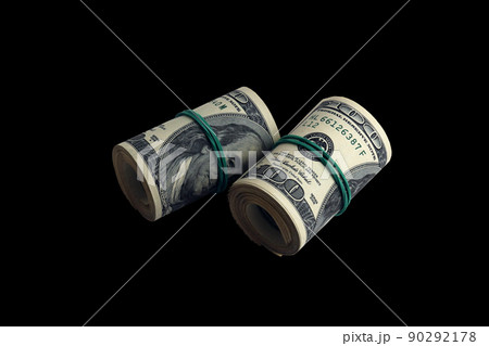 Bundle of US dollar bills isolated on black. Pack of american money with high resolution on perfect black background Bundle of US dollar bills isolated on black. Pack of american money with high resolution on perfect black background 90292178