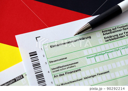 German annual income tax return declaration form with pen on flag close up. The concept of tax reporting in Germany German annual income tax return declaration form with pen on flag close up. The concept of tax reporting in Germany 90292214