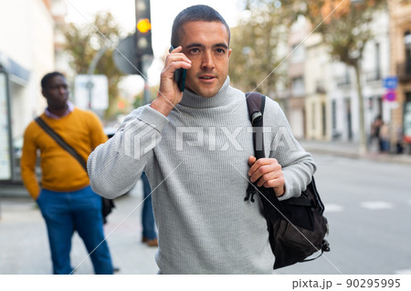 Caucasian man talking on phone outdoors 90295995