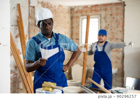 Foreman is dissatisfied with the work performed by the worker at construction site Foreman is dissatisfied with the work performed by the worker at construction site 90296257