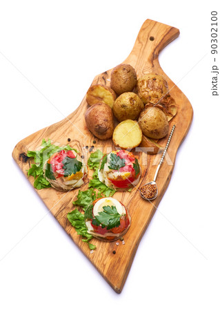 Portion of delicious chicken aspic on serving board isolated on white background 90302100