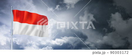 Indonesian flag on a cloudy sky 90303172