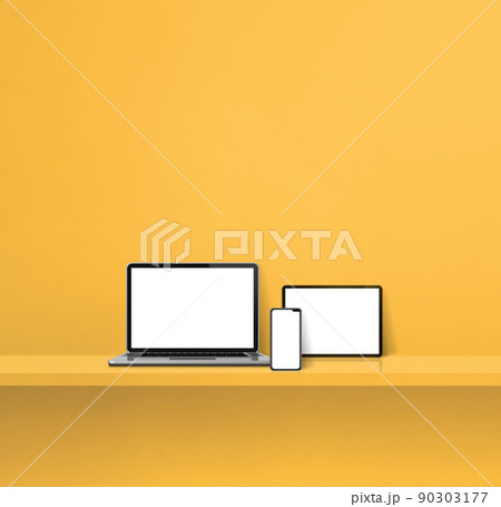Laptop, mobile phone and digital tablet pc on yellow wall shelf. Square background 90303177
