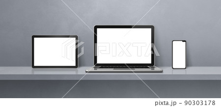 Laptop, mobile phone and digital tablet pc on grey wall shelf. Banner background 90303178