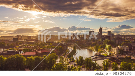 Rain over Vilnius with skyscrapers, colorful evening view of Vilnius with rain, capital of Lithuania Rain over Vilnius with skyscrapers, colorful evening view of Vilnius with rain, capital of Lithuania 90304276