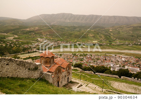 Panoramic aerial view to Berat old town and Osum river and Holy Trinity Church from Berat Castle , Albania Panoramic aerial view to Berat old town and Osum river and Holy Trinity Church from Berat Castle , Albania 90304634