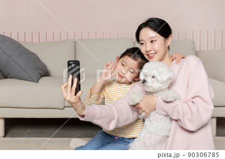 Asian Korean mother and daughter selfies with puppy dog Asian Korean mother and daughter selfies with puppy dog 90306785
