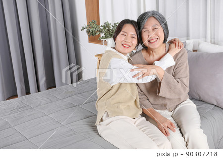 Asian Korean family_Grandmother and grandchild hugging Asian Korean family_Grandmother and grandchild hugging 90307218