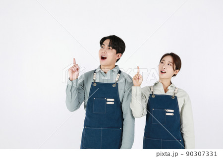 start up concept asian korean young woman and man with hand motions start up concept asian korean young woman and man with hand motions 90307331