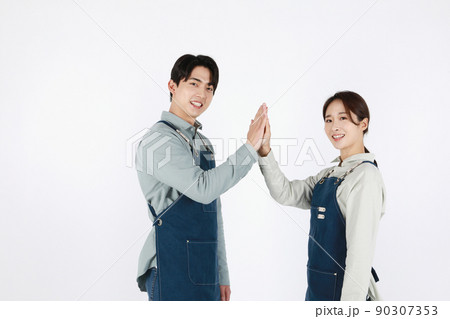 start up concept asian korean young woman and man with hand motions 90307353