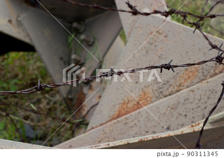 Detail hedgehod anti-tank barrier with barbed wire 90311345