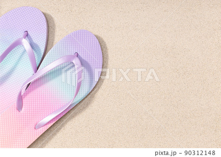 Summer background with fashion flip flops on beach sand background. Copy space. Top view Summer background with fashion flip flops on beach sand background. Copy space. Top view 90312148