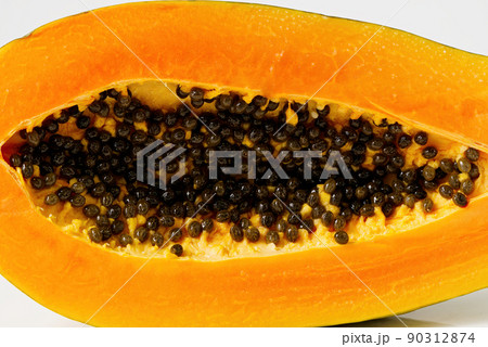 Close up of of ripe papaya. View of the Inside of a Papaya. Sweet tropical fruit Close up of of ripe papaya. View of the Inside of a Papaya. Sweet tropical fruit 90312874