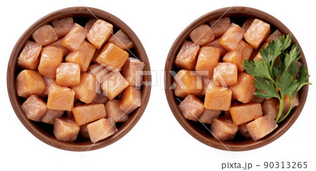 Salmon cut into cubes in a bowl 90313265