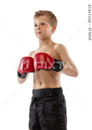 Closeup portrait of little boy, kid in sports shots and gloves posing on white studio background. Sport, education, action, motion concept. Closeup portrait of little boy, kid in sports shots and gloves posing on white studio background. Sport, education, action, motion concept. 90314619