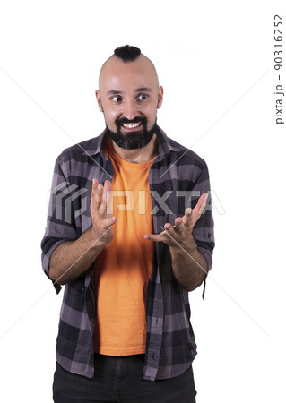 Excited hispanic young man giving an explanation Excited hispanic young man giving an explanation 90316252