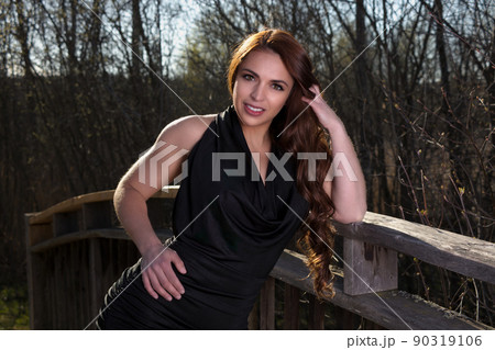 beautiful woman outdoor portrait elegance black dress at the park long hair brunette beautiful woman outdoor portrait elegance black dress at the park long hair brunette 90319106