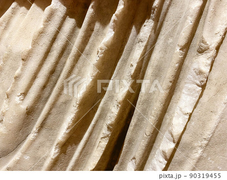 ancient texture. a stone of beige color, a piece of a statue. volumetric texture of stone and sand. a piece of fabric made of stone. fabric waves made by an artisan ancient texture. a stone of beige color, a piece of a statue. volumetric texture of stone and sand. a piece of fabric made of stone. fabric waves made by an artisan 90319455