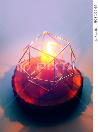 Hand made bee wax candle in a candleholder on wooden slice. Hand made bee wax candle in a candleholder on wooden slice. 90319544