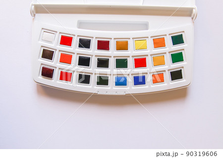 Watercolor paints on white background. Flat lay, top view Watercolor paints on white background. Flat lay, top view 90319606