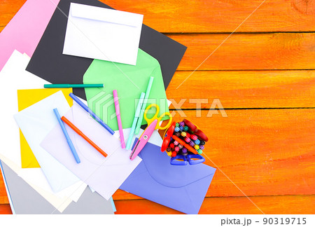 School supplies. Back to School design elements. Colorful markers and white empty paper sheet on aged wooden table. School supplies. Back to School design elements. Colorful markers and white empty paper sheet on aged wooden table. 90319715