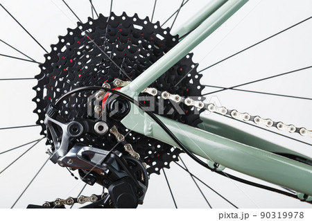 Rear bicycle cassette speeds with a wide range and chain close-up Rear bicycle cassette speeds with a wide range and chain close-up 90319978