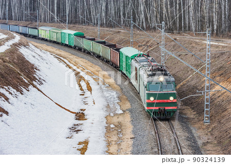 Freight train arrives to the station at winter day. Freight train arrives to the station at winter day. 90324139