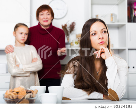 Upset woman after quarrel with family 90324192