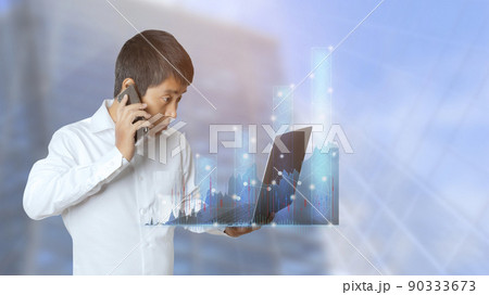 Businessman stock trading analyzing graph chart forex by using laptop computer and smart phone. Businessman stock trading analyzing graph chart forex by using laptop computer and smart phone. 90333673