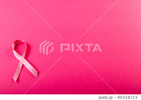 Directly above shot of breast cancer awareness pink ribbon isolated on pink background, copy space Directly above shot of breast cancer awareness pink ribbon isolated on pink background, copy space 90338723