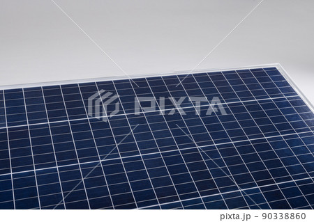 High angle view of blue solar panel isolated against white background, copy space 90338860