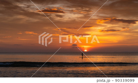 man surfing in the summer sunset 90339099