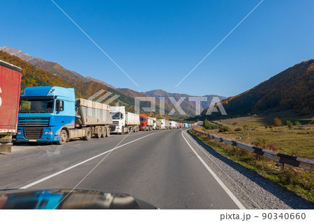 Trucks on roadside near mountains Trucks on roadside near mountains 90340660