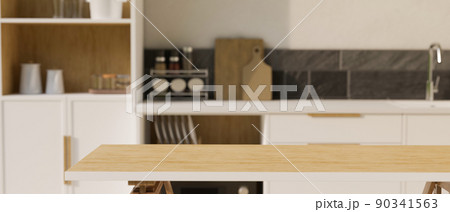 Wooden kitchen tabletop or dining table with empty space over blurred kitchen space 90341563