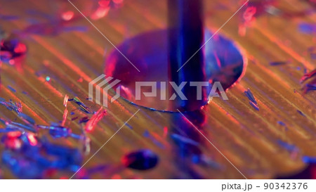 CNC machining of a hole in metal, macro shot 90342376
