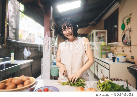 Happy young adult asian woman leisure with cooking in kitchen on day. Happy young adult asian woman leisure with cooking in kitchen on day. 90343603